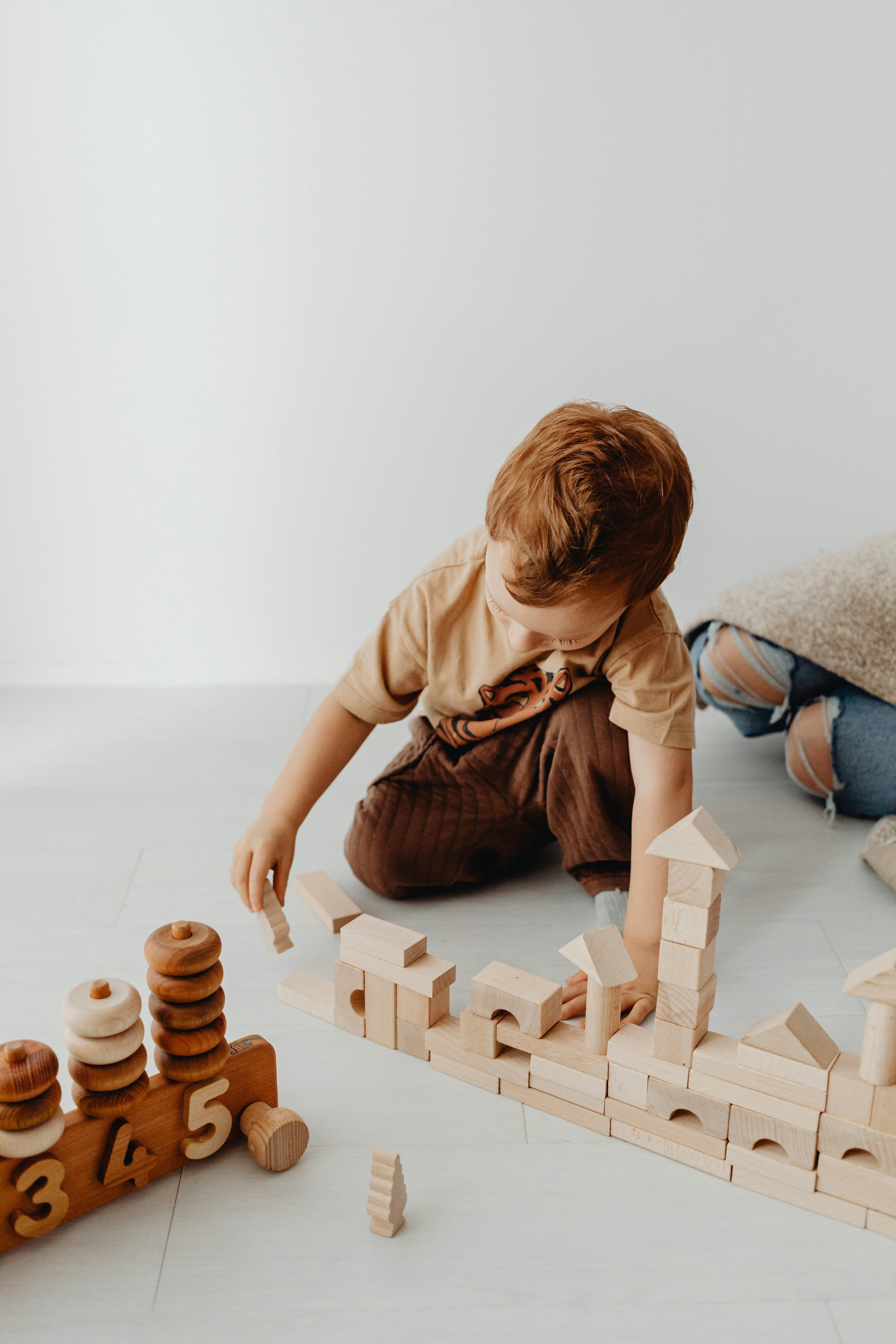 A kindergarten child playing with blocks at Picolini's place